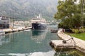 Small cruise ship moored at the pier in the center of Kotor city Royalty Free Stock Photo