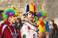 Kotor / Montenegro - March 03 2019: Traditional Winter Kotor Carnival. Participants of Carnival against ancient walls of Old Town