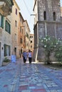 Kotor, Montenegro - 8/6/2019; Tourists walking along stone streets in Kotor, Montenegro