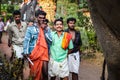 Group indian people watching on elephants walking by village at religion feast