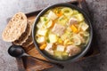 Kottsoppa soup is a meat and root vegetables include carrot, potato, celeriac, parsnip, turnip and Rutabaga close-up on a plate.