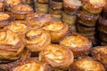 Kouign amann pastries stacked at a bakery