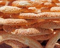 `Koulouri` Greek sesame bagels pile close up, food background
