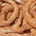 `Koulouri` Greek sesame bagels pile top view close up, food background