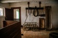 Kourim, Bohemia, Czech Republic, 26 December 2021: Interior of Traditional village house, barn with agricultural tools, troughs