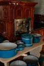 Kourim, Bohemia, Czech Republic, 17 December 2023: Interior of Traditional village house, brown ceramic stove and blue pots and