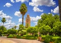 Koutoubia Mosque minaret at medina quarter of Marrakesh, Morocco. There is beautiful green garden with palms. Blue sky is in the Royalty Free Stock Photo