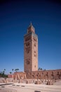 Koutoubia Mosque Minaret in Morocco Marrakesh and gardens during sunset with blue sky. Inside Medina. Royalty Free Stock Photo