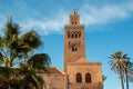 Koutoubia Mosque and palm trees in Marrakech at evening Royalty Free Stock Photo