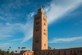 Koutoubia Mosque and palm trees in Marrakech at evening Royalty Free Stock Photo