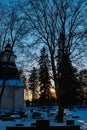 Kouvola, Finland - 10 March 2021: Bell tower of Valkeala church in sunset