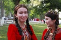 Ashgabat, Turkmenistan - May 25, 2017: Group of smiling female students in red national dresses with embroidery. Ashgabat, Turkm Royalty Free Stock Photo