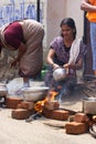 KOVALAM, KERALA, INDIA, April 1, 2015: Some women devotees participate in Pongala ceremony where boiled rice made in