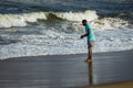 Kovalam, Tamil Nadu, India - February 04 2021: Fisherman catching crabs in the shore along the Kovalam beach, Chennai, India