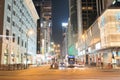 Night long exposure of passing vehicles on busy city street. Royalty Free Stock Photo