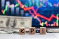 KPI, Key Performance Indicator concept, small cube block with alphabets building the word KPI on yearly chart and graph Royalty Free Stock Photo