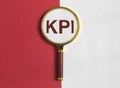 KPI, key performance indicator word acronym through magnifying glass Royalty Free Stock Photo