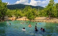 Emerald crystal blue water pool in Thailand, citizens and tourists swiming