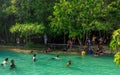 Emerald crystal blue water pool in Thailand, citizens and tourists swiming