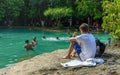 Emerald crystal blue water pool in Thailand, citizens and tourists swiming