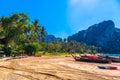 KRABI, THAILAND- MARCH 2018: Long tail boats on tropical beach with palms, Tonsai Bay, Railay Beach, Ao Nang, Krabi, Thailand Royalty Free Stock Photo