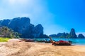 KRABI, THAILAND- MARCH 2018: Long tail boats on tropical beach with palms, Tonsai Bay, Railay Beach, Ao Nang, Krabi, Thailand Royalty Free Stock Photo