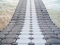 Plastic pontoon walk way floating in the sea Royalty Free Stock Photo