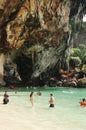 KRABI, THAILAND - OCTOBER 27, 2013: picturesque sheer cliff above sea with swimming people