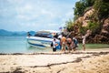 Krabi Thailand. October 2010. Tourists embark on boats on beach