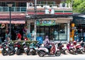 Krabi Town, Thailand - November 24 2019: Bike and scooters parked on the side of the road. Local use scooters as main mode of