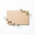 Kraft brown memo pad, empty paper with eucalyptus leaves on white background Royalty Free Stock Photo