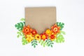 Kraft envelope with floral of paper ornament. Apartment, top view.