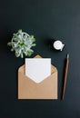 Envelope, fountain pen and inkwell are on a black background Royalty Free Stock Photo