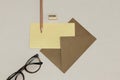 The kraft envelope, wooden pencil & sharpener, spectacles on the white texture