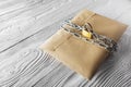 Kraft envelopes with letters and padlock, chain on old white wooden background. Protection of your post, PC mailing. Blanks for th