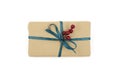 Kraft gift box with blue ribbon is on a white Royalty Free Stock Photo
