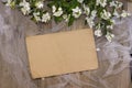 Kraft paper background on a wooden background with jasmine flowers Royalty Free Stock Photo
