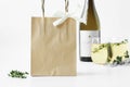 Kraft paper bag mockup with wine bottle and wine glass.