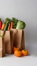 Kraft paper bag with vegetables. Layout for advertising. View from above. Royalty Free Stock Photo