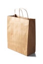 Kraft paper ecologic bag on isolated white background with shadows Royalty Free Stock Photo