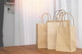 Kraft paper shopping bags on wood table