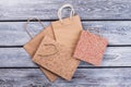 Kraft paper shopping bags on wooden background. Royalty Free Stock Photo