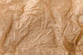 Kraft paper texture. Brown crumpled paper. Crinkled wrap sheet, recycle grunge texture sample. Closeup of parchment