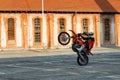 Kragujevac, Serbia - July 18, 2016: Willy motorcycle stunt. Extreme biker ride motocycle on one wheel in Stara Livnica, old factor