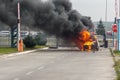 Krakovets, Ukraine - August, 2019: Burning car at the gates of a closed area. It caught fire on the go due to a faulty power