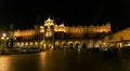 Krakow Main Square in the Old Town at night in Poland, illuminated Renaissance Cloth Hall Sukiennice and Adam Royalty Free Stock Photo
