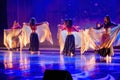 Krakow, Poland - April 01, 2019: Girls in groups performing dance on Indian music during holi event. Bollywood dance