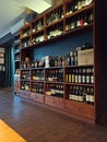 Krakow, Poland: A huge wooden shelf of vintage bottles of wine. Interior of an Italian restaurant