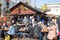 KRAKOW, POLAND, April 2, 2018, Many people sit at large wooden t Royalty Free Stock Photo