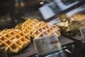 Krakow, Poland, August 2017: Appetizing waffles on a showcase of a cafe in Poland Royalty Free Stock Photo